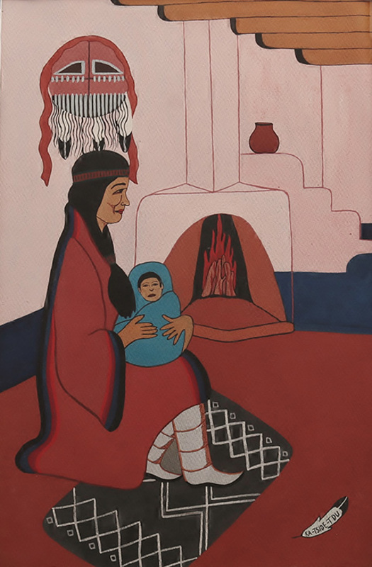 Mother holding baby by fireside