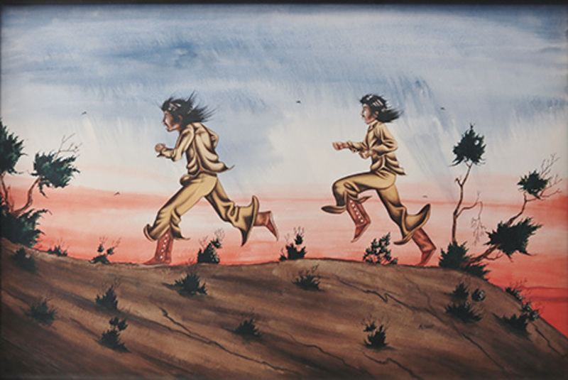 Two boys running in desert